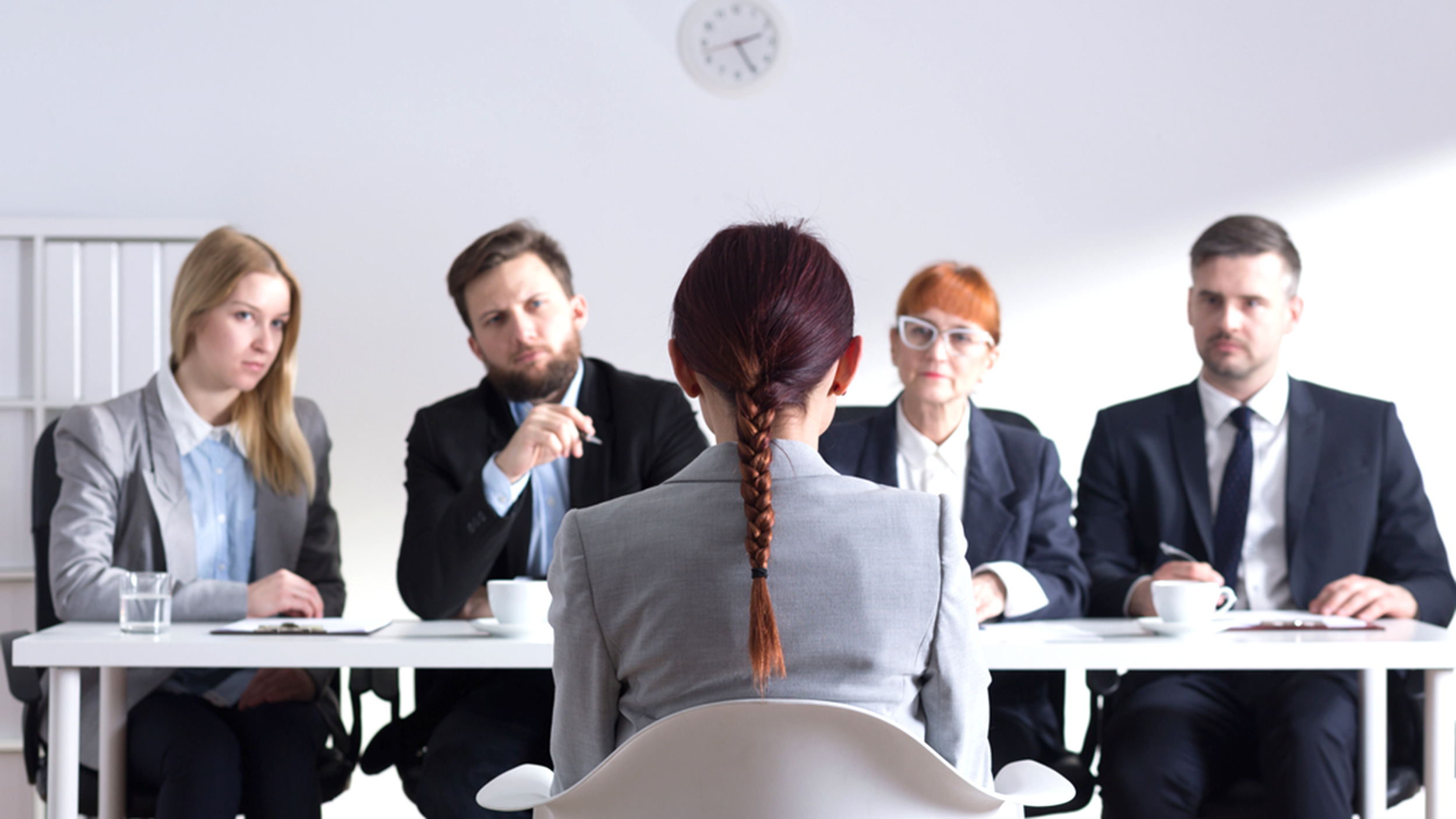 Woman during job interview and four elegant members of management; Shutterstock ID 370947476; PO: angelikiJ-for robin kawakami