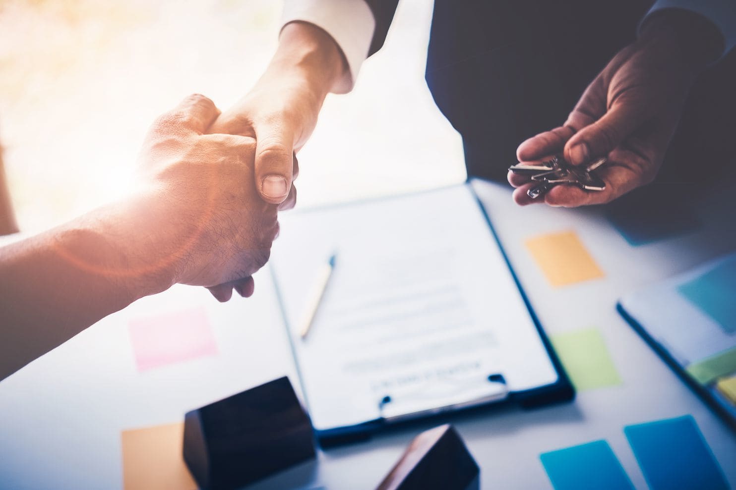 shaking hands at a meeting