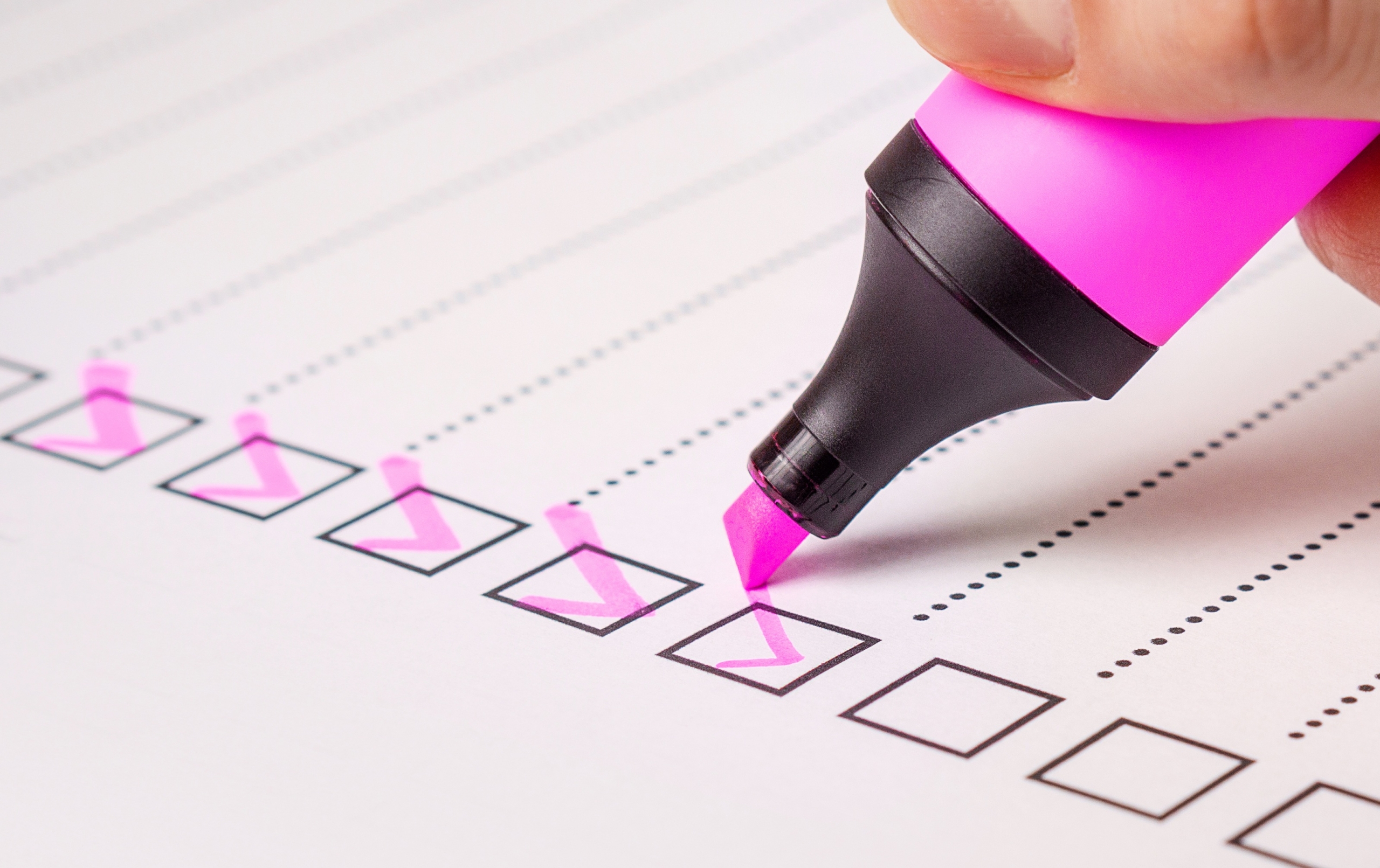 a pink highlighter pen check boxes on a form