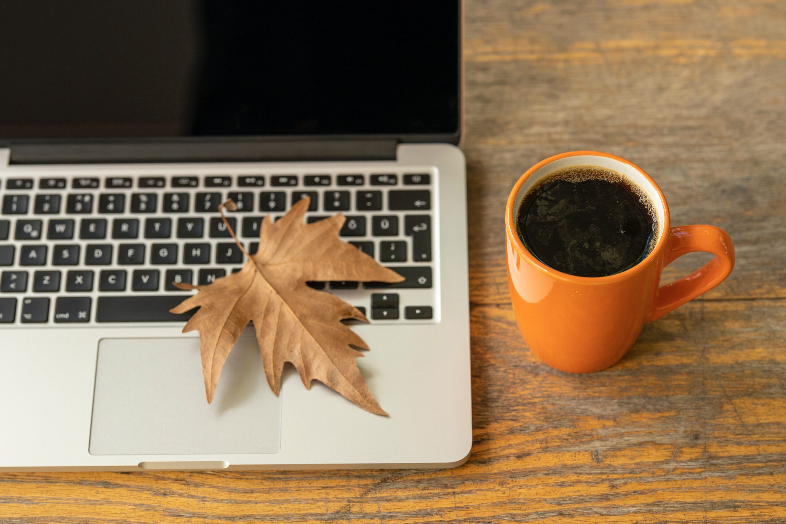 Computer and Coffee with Fall Foliage